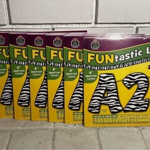 7 new packages of 4” punch out letters, 81 characters per pack, zebra patterned